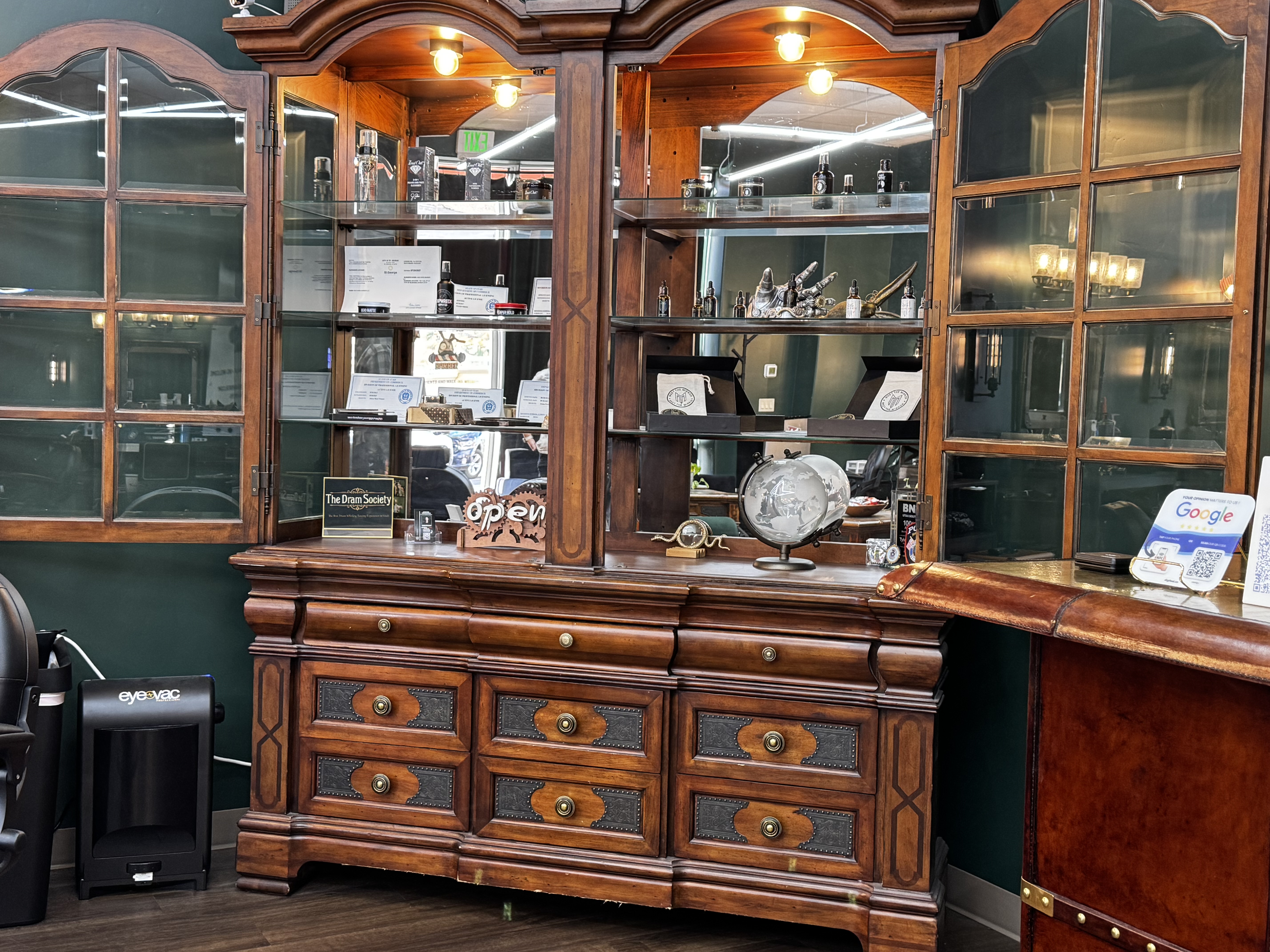 Product cabinet and front desk at Mad Hare Barber