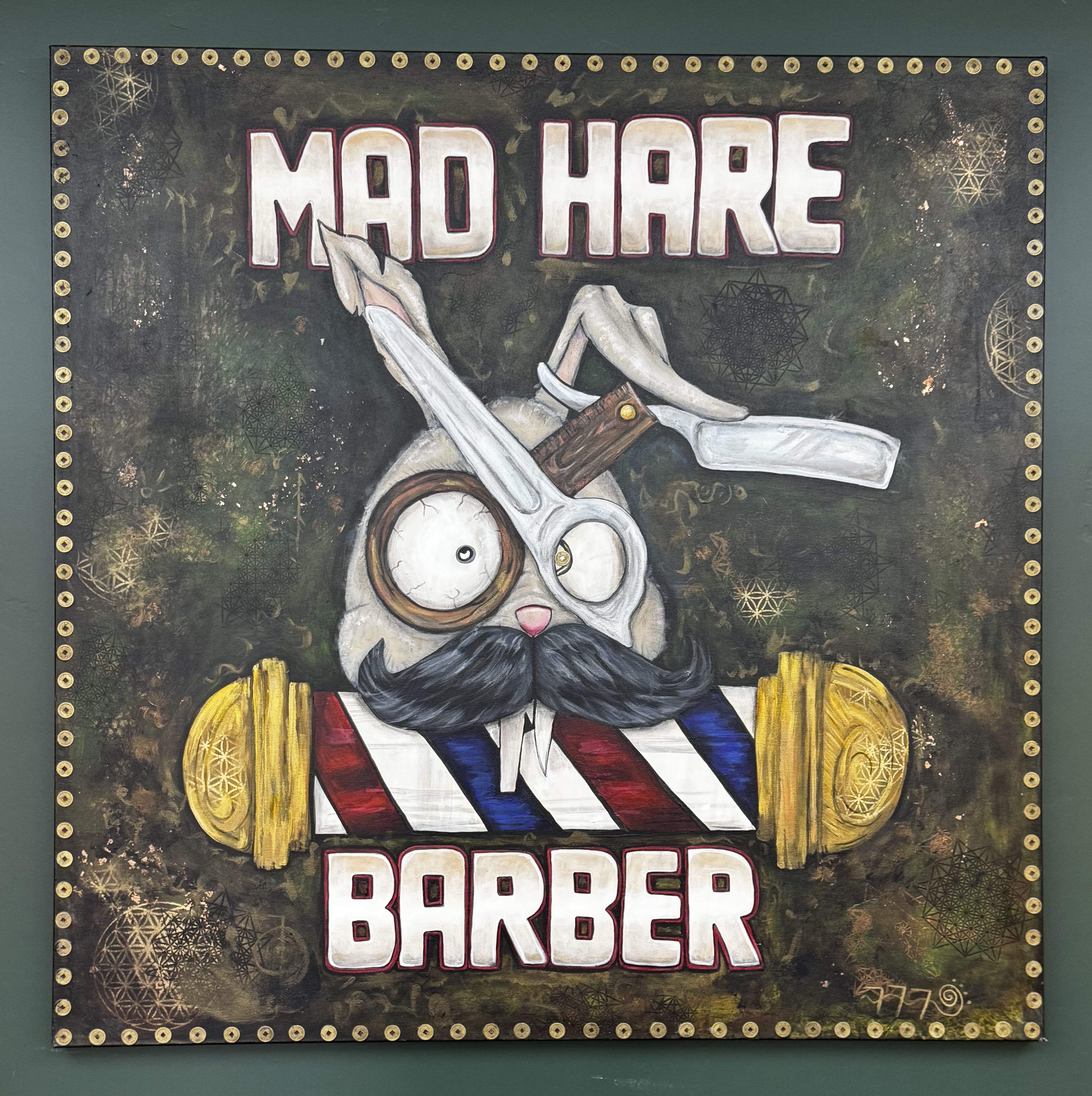 Hand-painted Mad Hare Barber sign inside the St. George shop